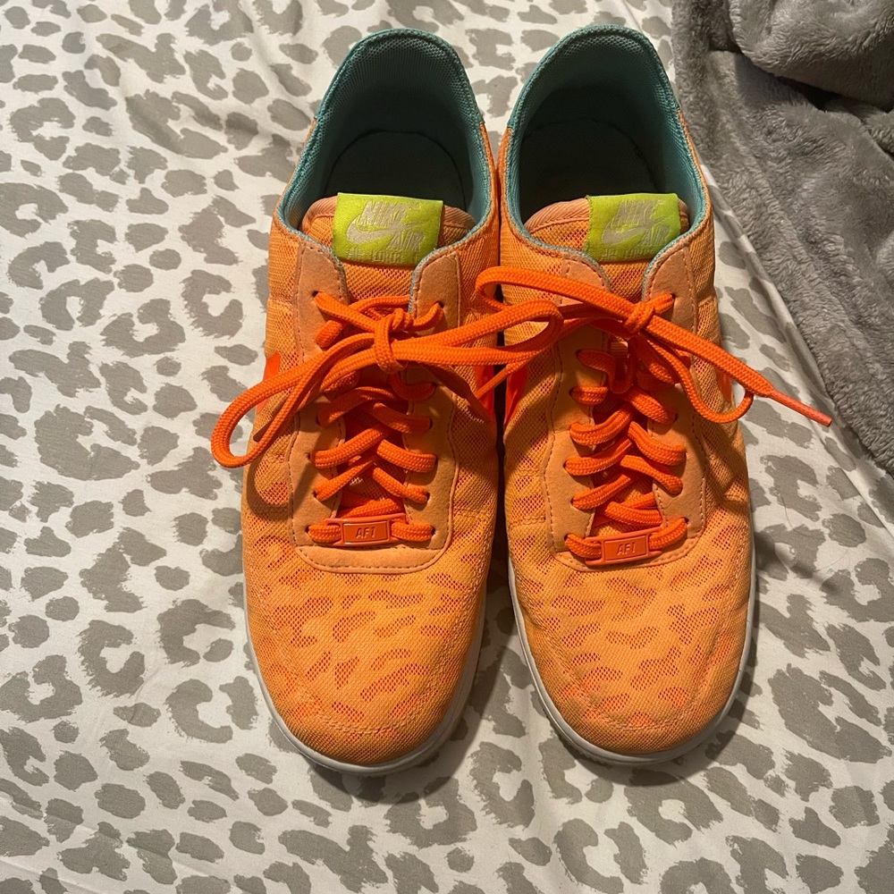 Orange Nike shoes.